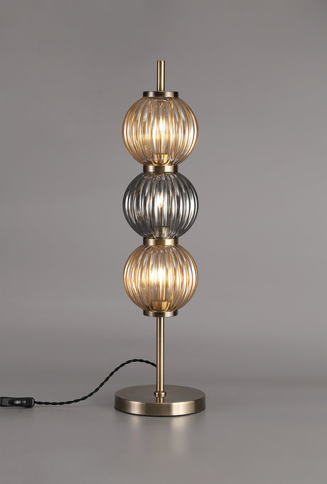 FRA6447 Franz 67cm Table Lamp 3 Light in a Antique Brass/Smoked/Amber Finish